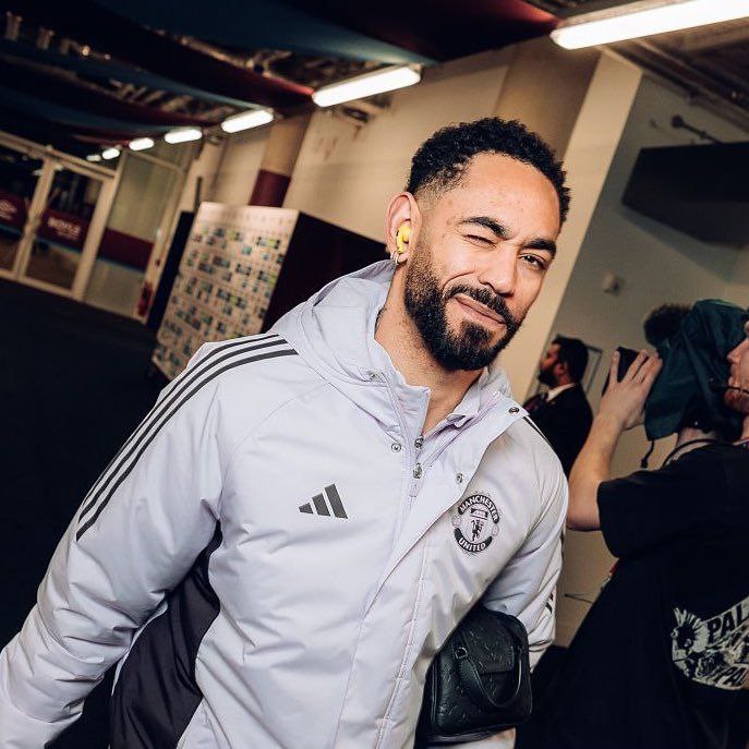 a man with a beard and a white jacket